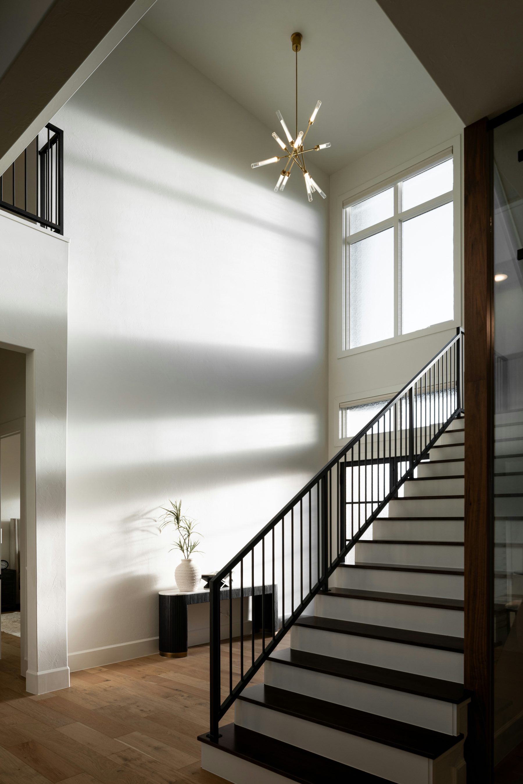 Custom home interior staircase with chandelier — Fraser Valley new build